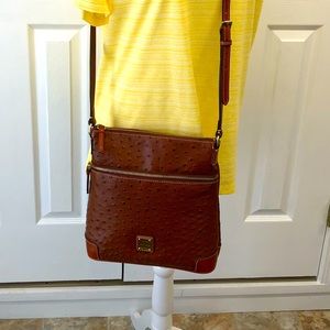 Brown Dooney and Bourke ostrich style leather cross body purse.